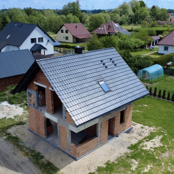 Kompleksowa budowa murowanego energooszczędnego domu jednorodzinnego do stanu surowego zamkniętego 90 m2, Namysłów. Projekt firmy Archon: Dom w Kronselkach